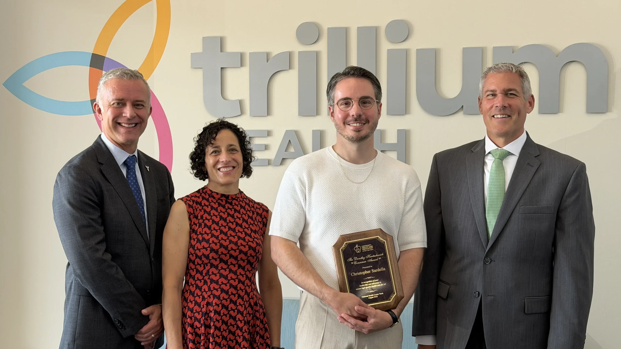 Trillium Health Board Member Chris Sardella receives an award from NYS